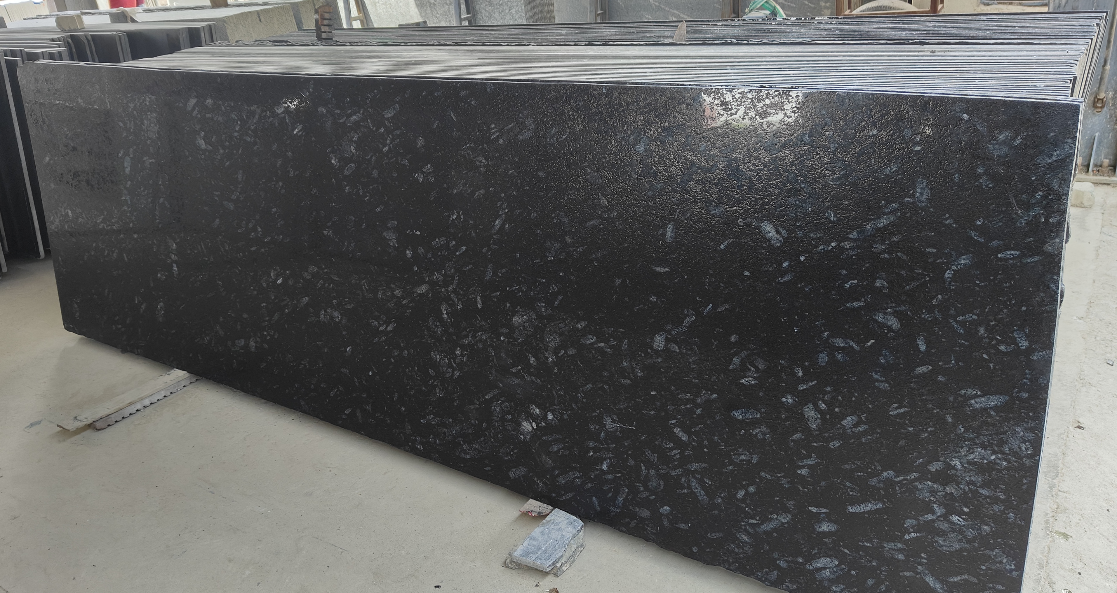 Pearl Black granite slab with lapatro finish for flooring and cladding